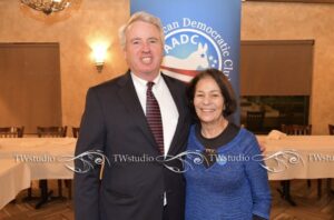Chris Kennedy, candidate for governor, being introduced by Miriam Zayed
